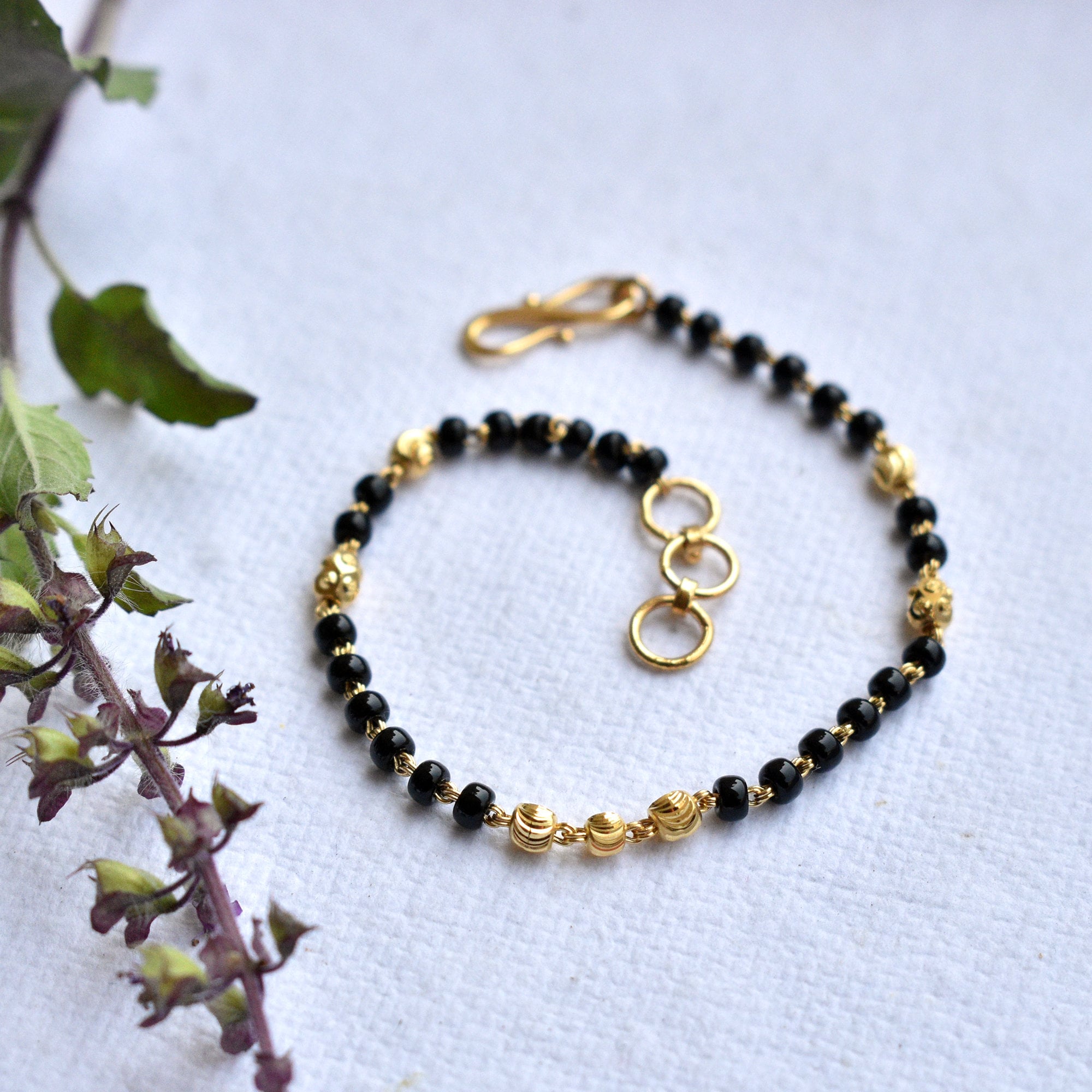 Buy Gold Design Newborn Baby Gold and Black Beads Bracelet for Baby